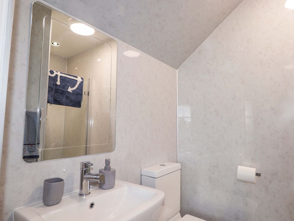 A bathroom with a sink and toilet at Crannoch Self Catering in Cullen
