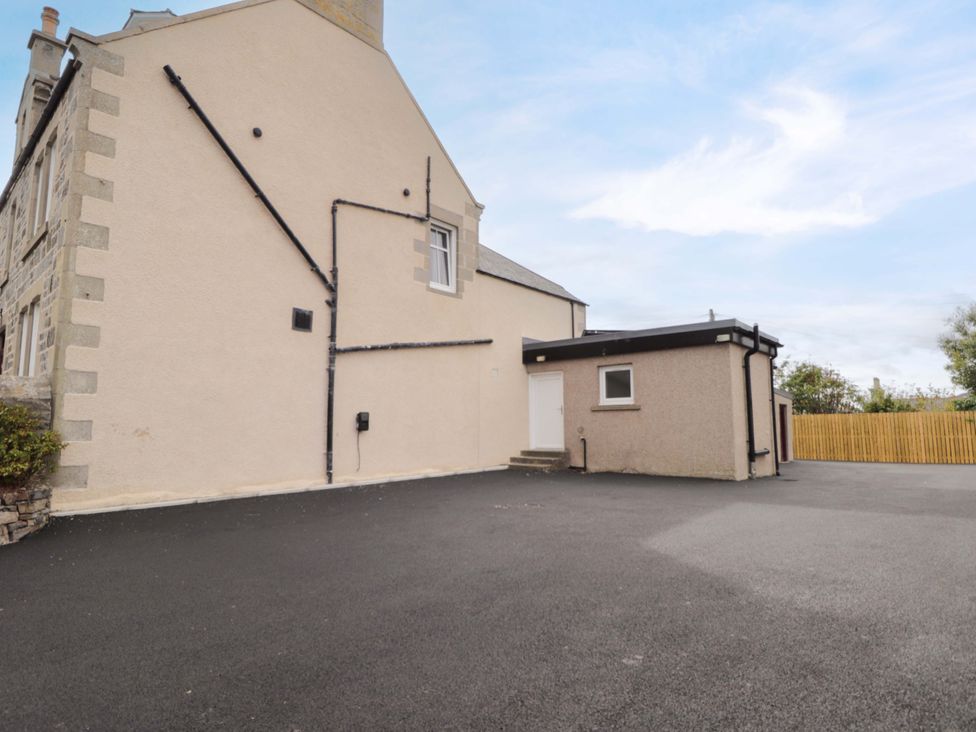 An exterior view of a property with entrance and parking area at Crannoch Self Catering in Cullen