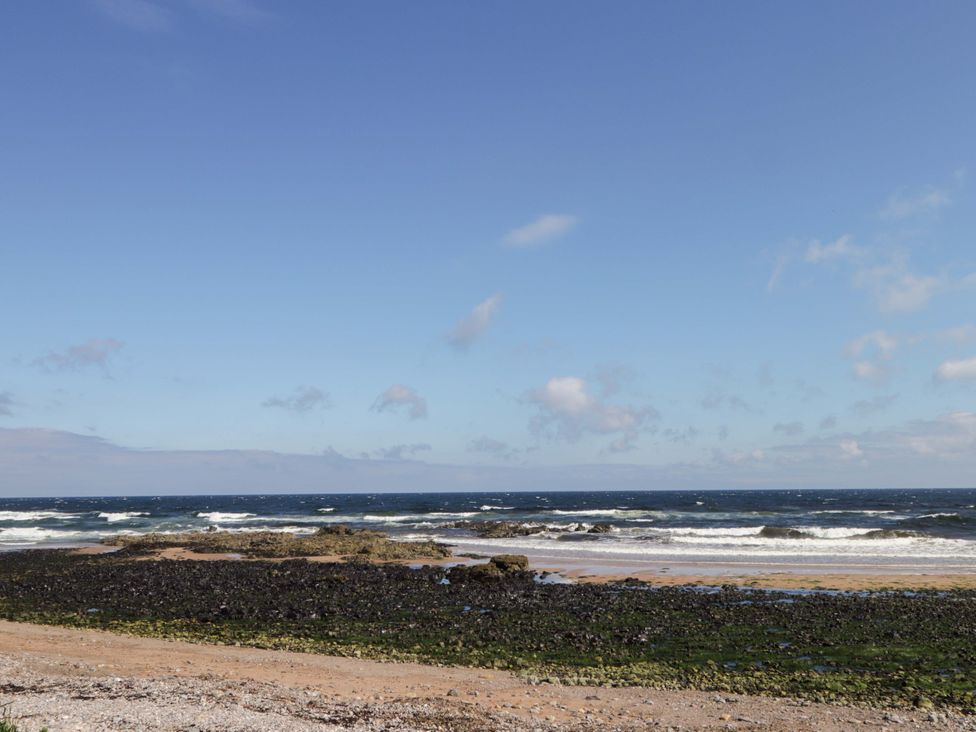 A view of the ocean and beach at Crannoch Self Catering in Cullen