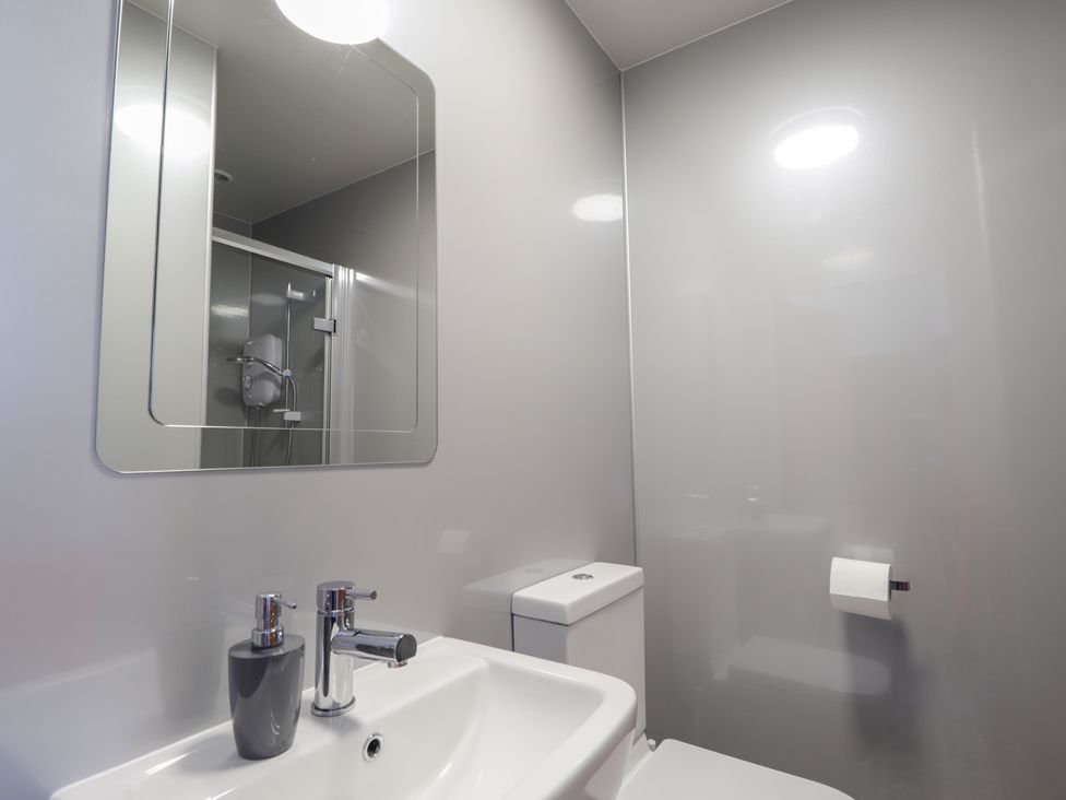 A bathroom with a sink and a toilet at Crannoch Self Catering in Cullen