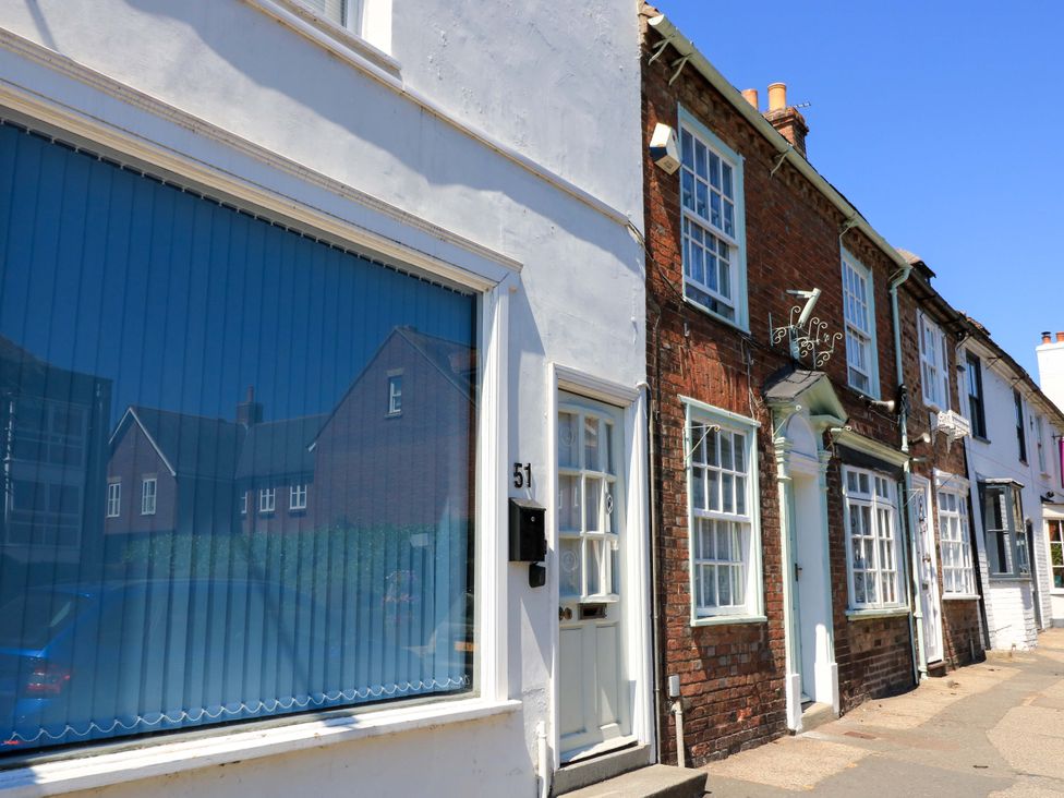 An outdoor view of houses with windows and doors at Delightful Dorset House By Wareham River Wareham
