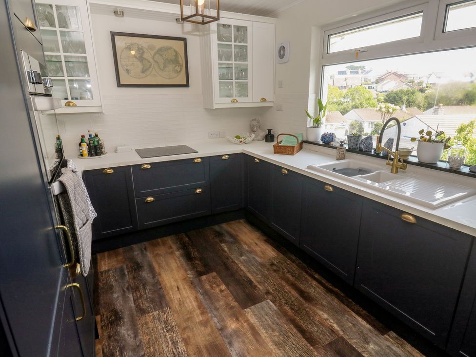 A kitchen with cabinets and a sink at 4 Cardell Way Newquay