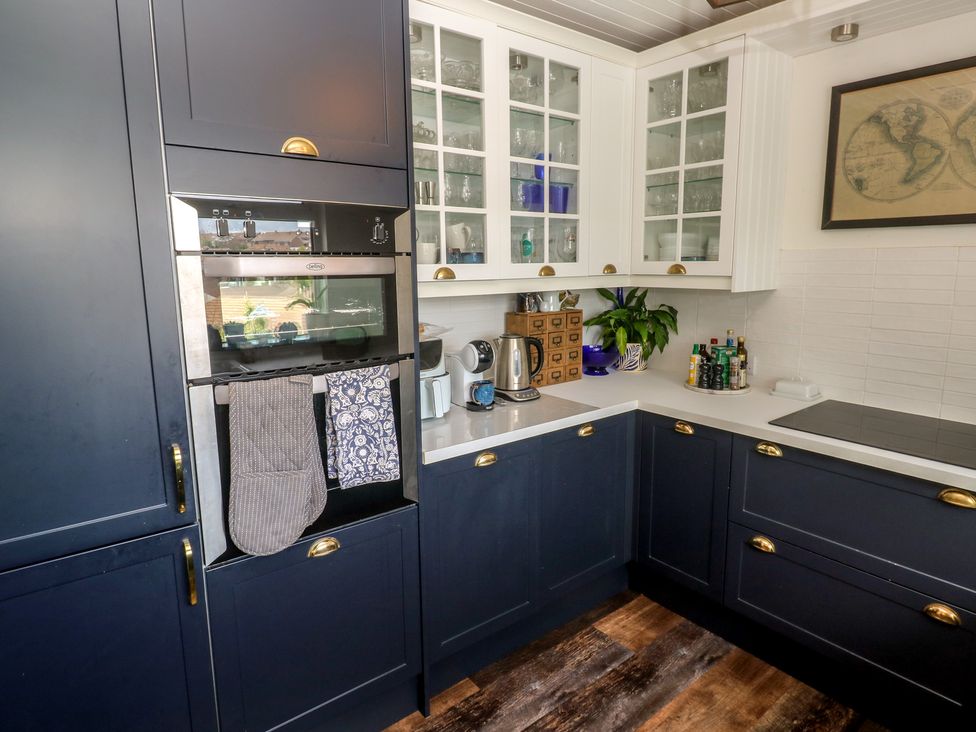 A kitchen with cabinetry and appliances at 4 Cardell Way in Newquay
