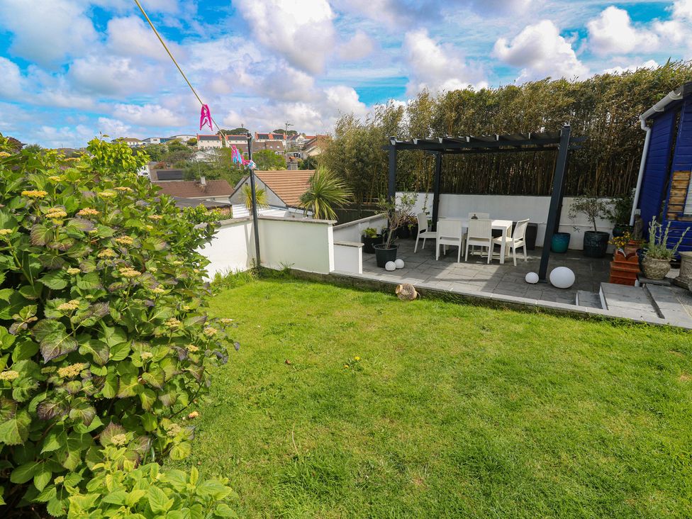 An outdoor space with a seating area and plants at 4 Cardell Way Newquay