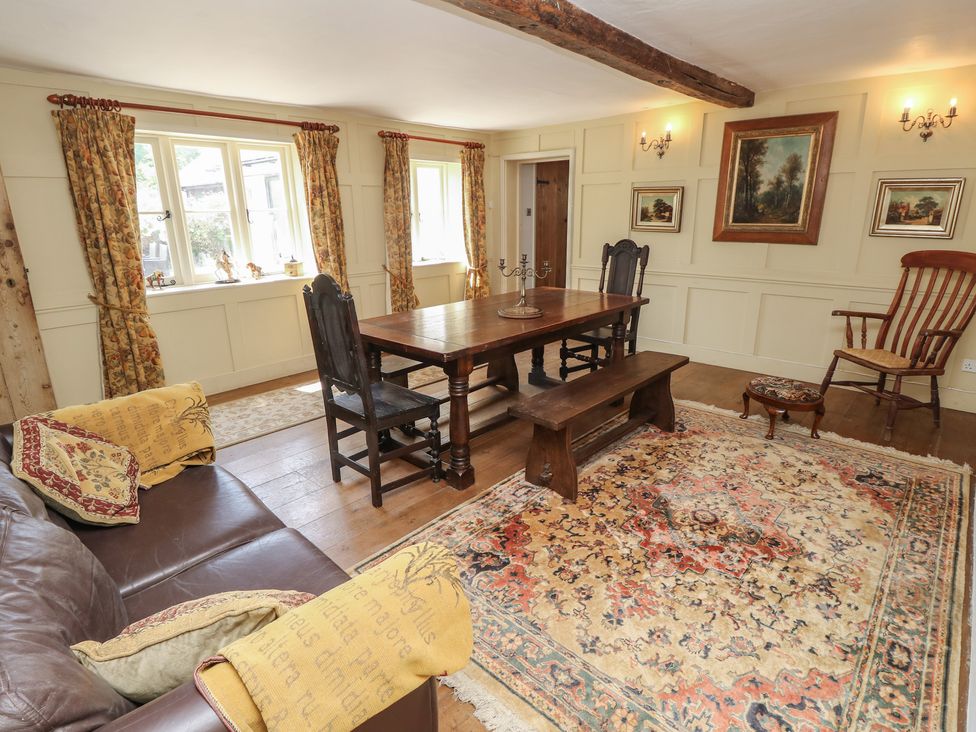 A dining room with a table and chairs at Guildford Farmhouse in Ryde