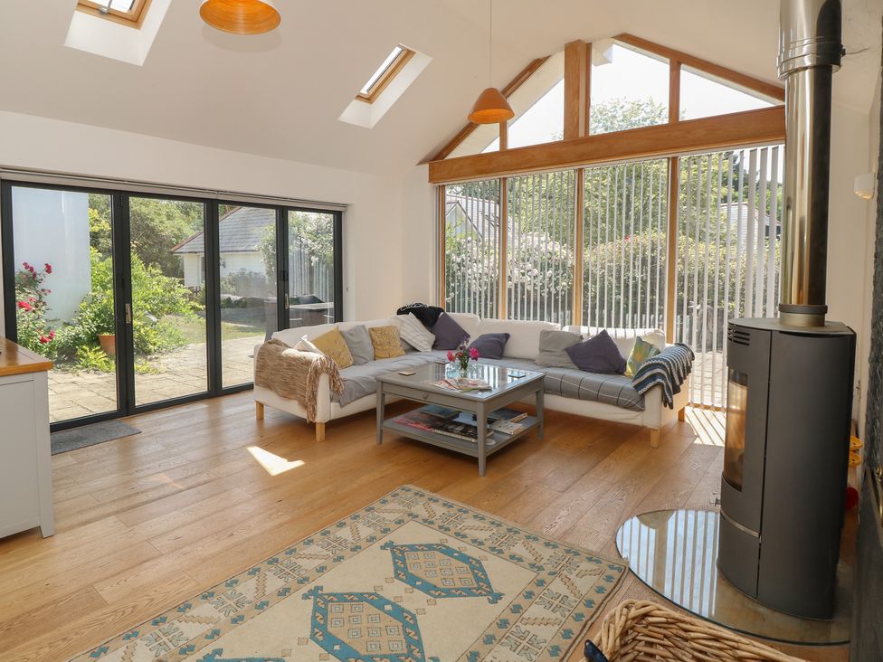 A living room with a sofa and coffee table at Guildford Farmhouse in Ryde
