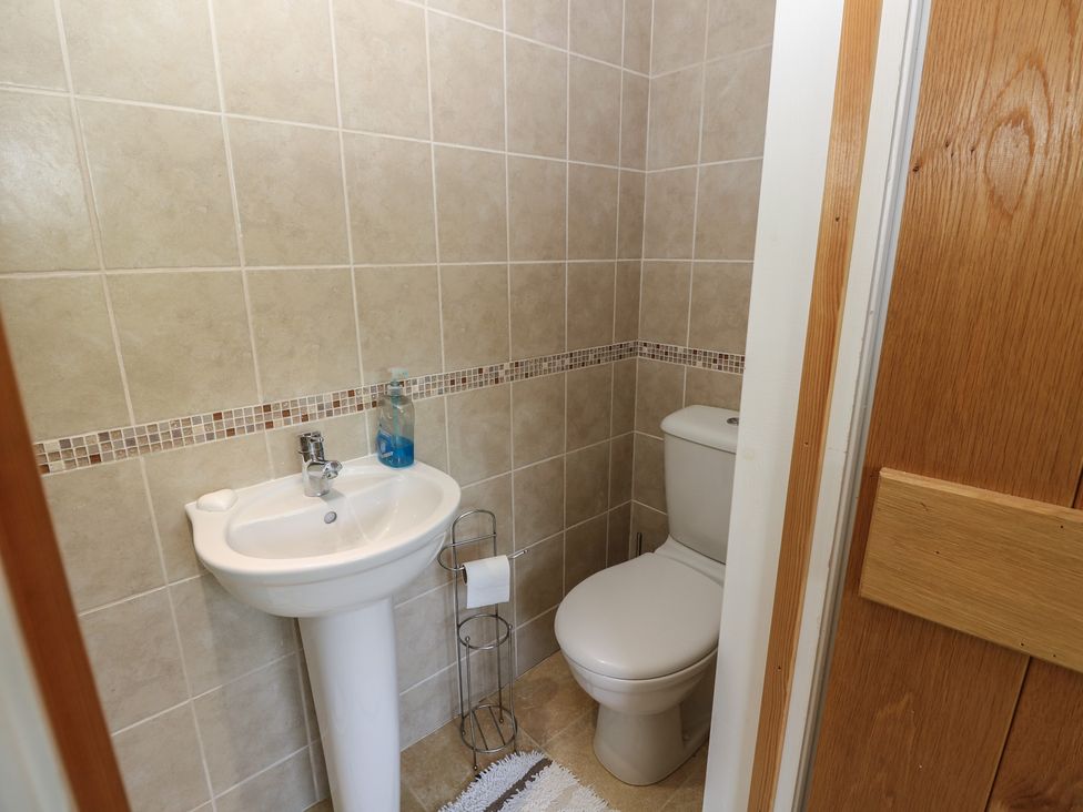 A bathroom with a sink and toilet at Guildford Farmhouse in Ryde