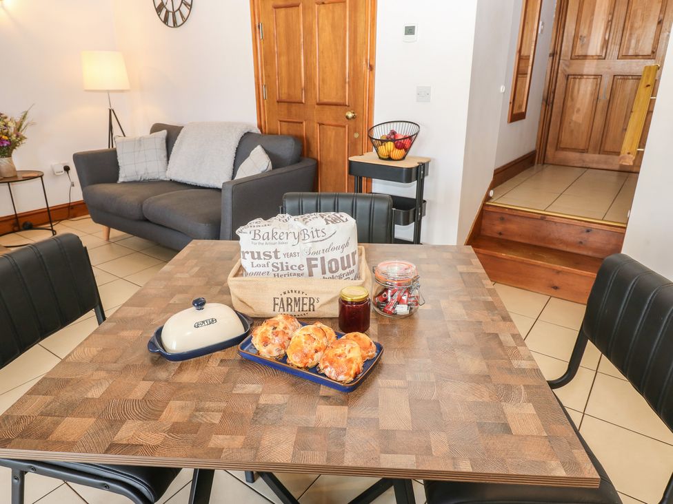 A dining room with a table and chairs at Wellhope View Cottage in Alston