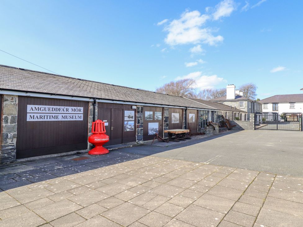 An outdoor view of a maritime museum with signage at Harbwr Hideaway Porthmadog