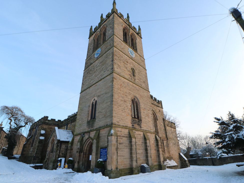 A church tower covered in snow at Antoninus Barn 2 in Ebchester