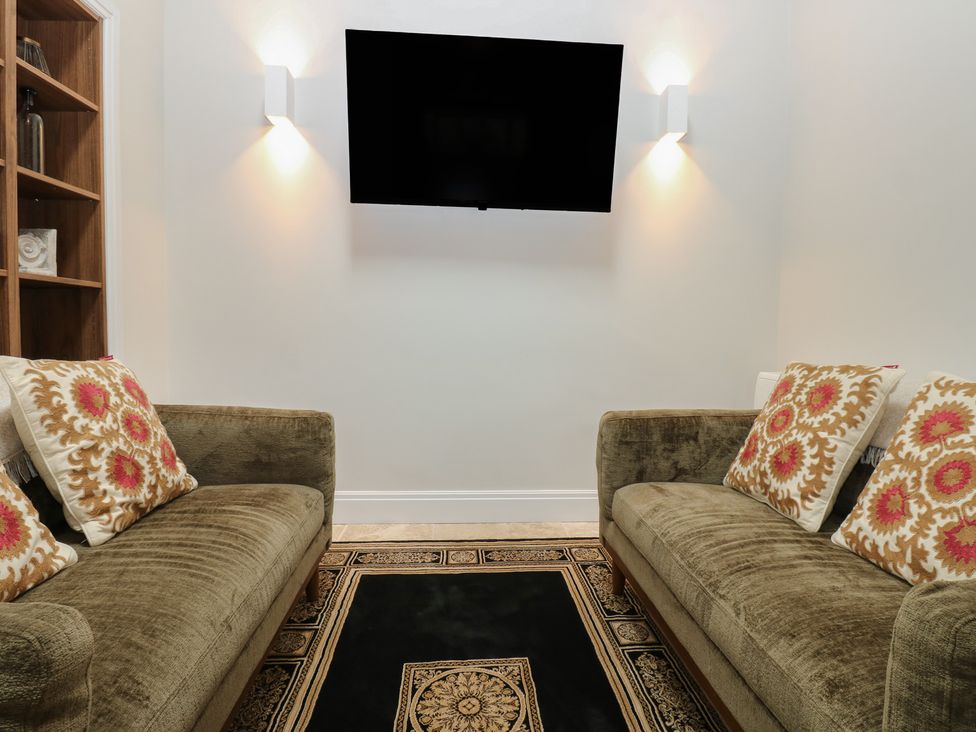 A living room with sofas and a television at Antoninus Barn 2 in Ebchester