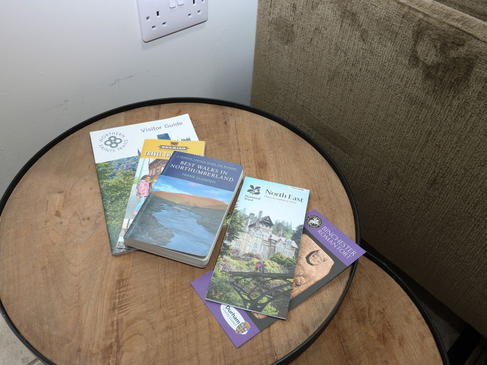 A table with various visitor guides at Antoninus Barn 2, Ebchester