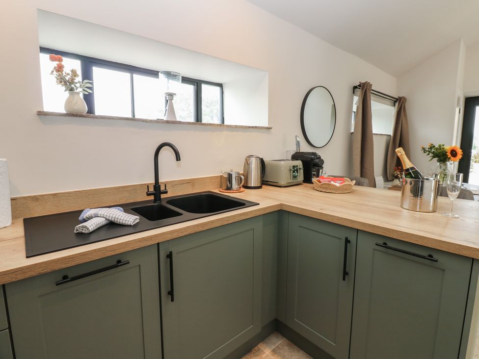 A kitchen with a sink and appliances at Antoninus Barn 2 in Ebchester