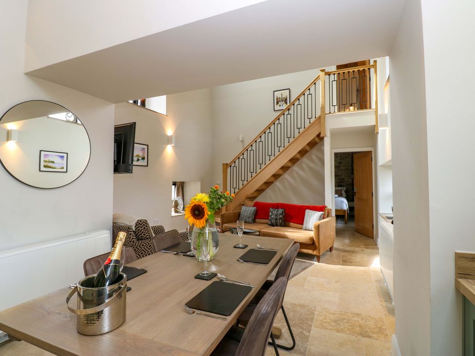 A dining room with a table and chairs at Marcus Barn 3 Ebchester