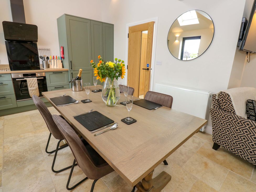 A dining room with a table and chairs at Marcus Barn 3 Ebchester