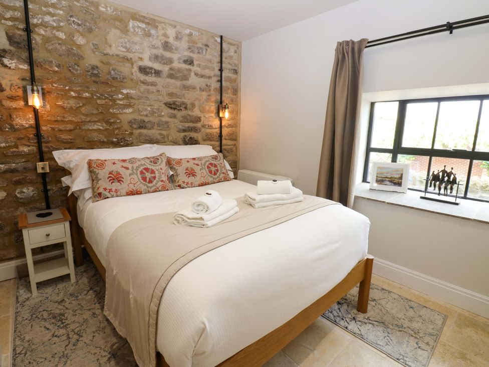 A bedroom with a bed and window at Marcus Barn 3 in Ebchester