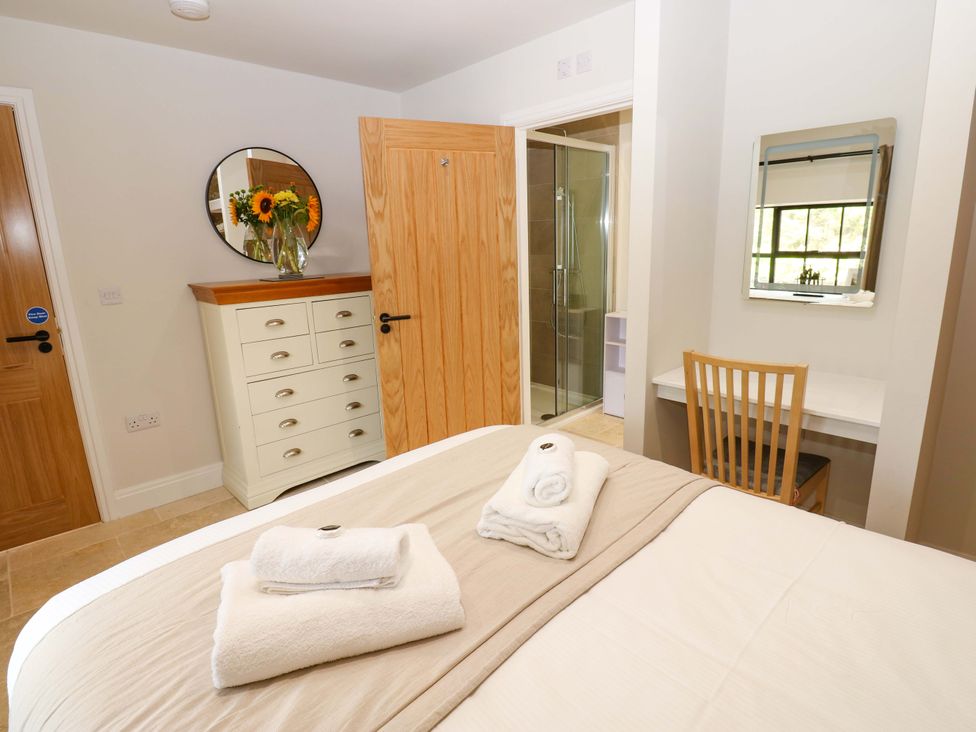 A bedroom with a bed and chest of drawers at Marcus Barn 3 Ebchester