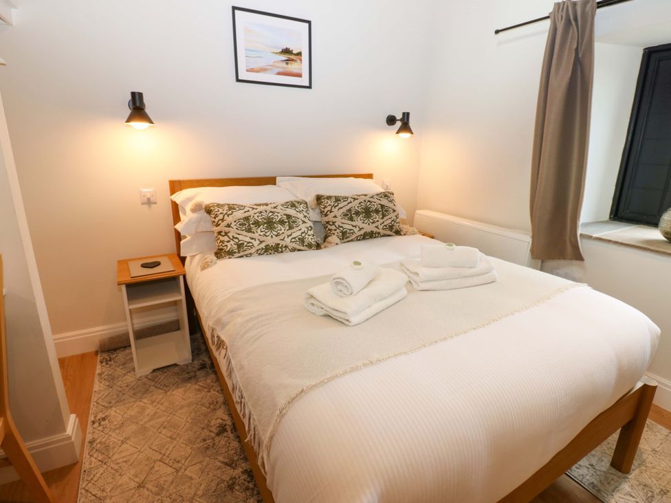 A bedroom with a bed and bedside table at Marcus Barn 3 Ebchester