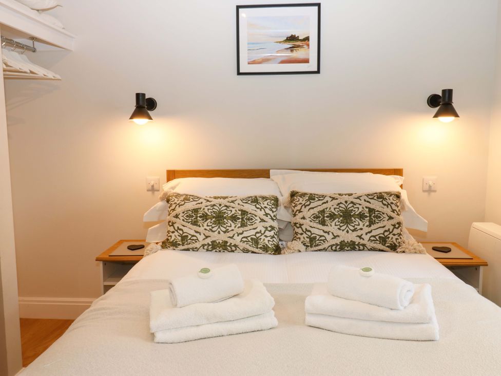 A bedroom with a bed and pillows at Marcus Barn 3, Ebchester