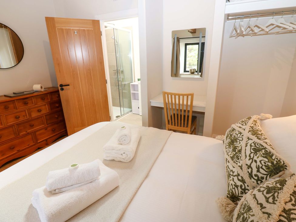 A bedroom with a bed and dresser at Marcus Barn 3 Ebchester