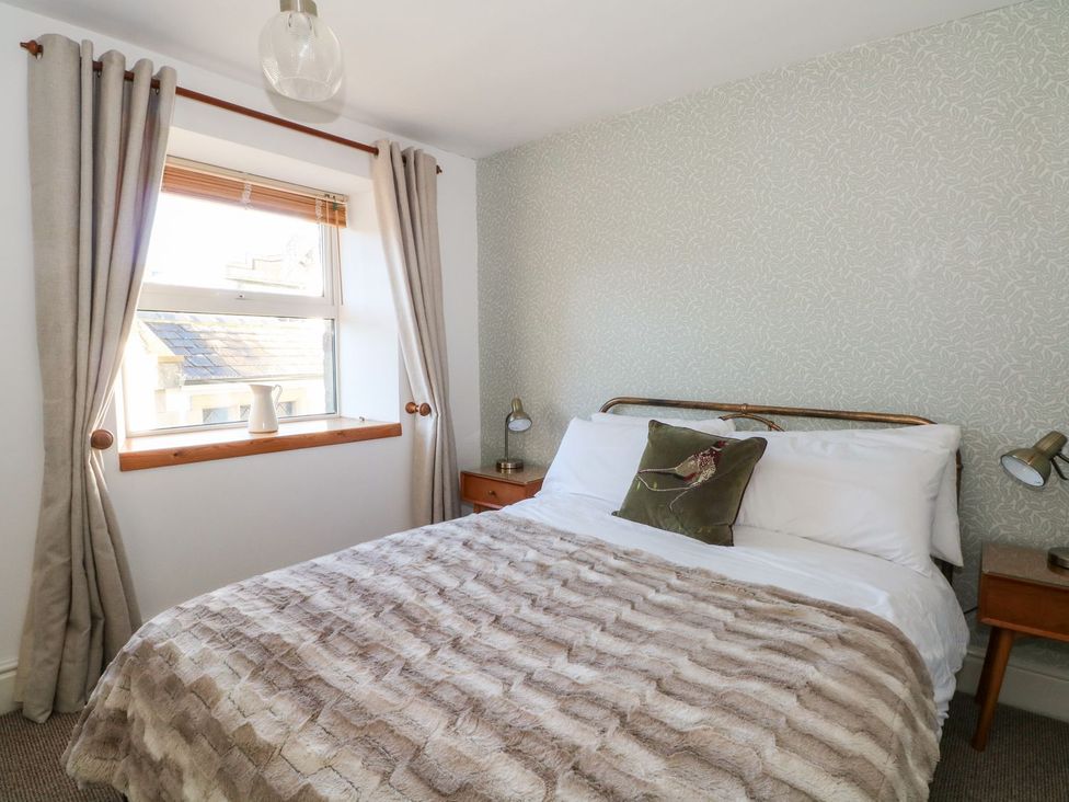 A bedroom with a bed and window at TOB Grave Prospect