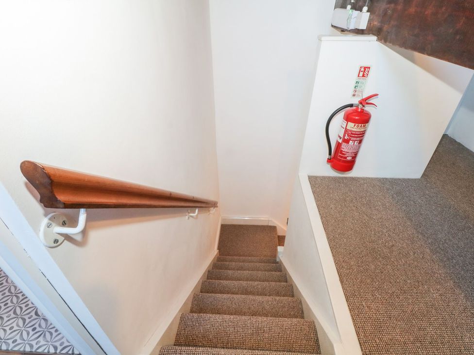 Stairs with a handrail and fire extinguisher at TOB Grave Prospect