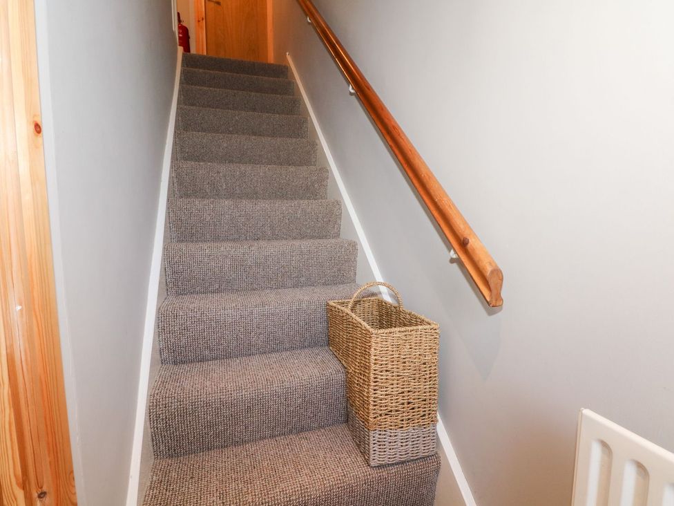 A staircase with a basket on the steps at TOB Grave Prospect