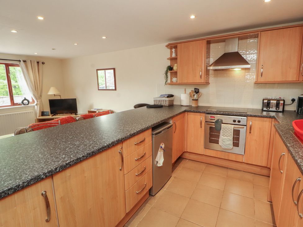 A kitchen with appliances and a counter at Valley View in Cleator Moor