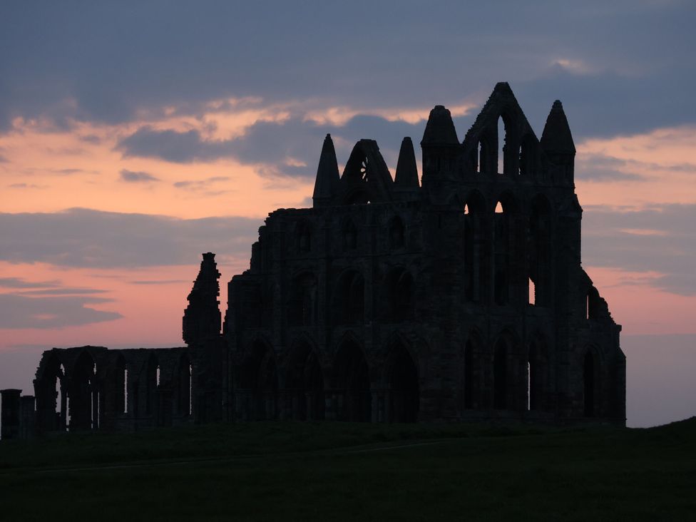 Silhouette of ruins at dusk at Willow Lodge in Whitby