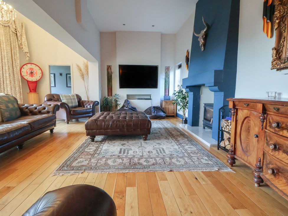 A living room with a sofa and coffee table at The Colonnade in Trefnant
