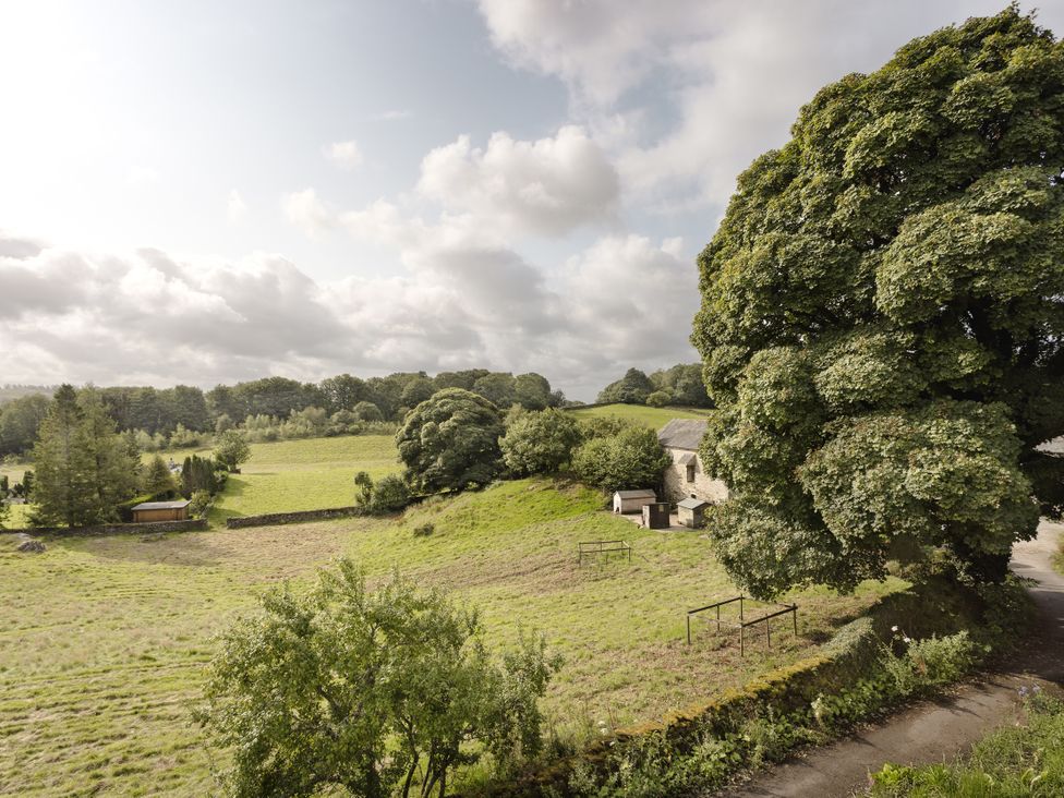 A view of a field and trees at Tethers End in Lindeth near Bowness-On-Windermere