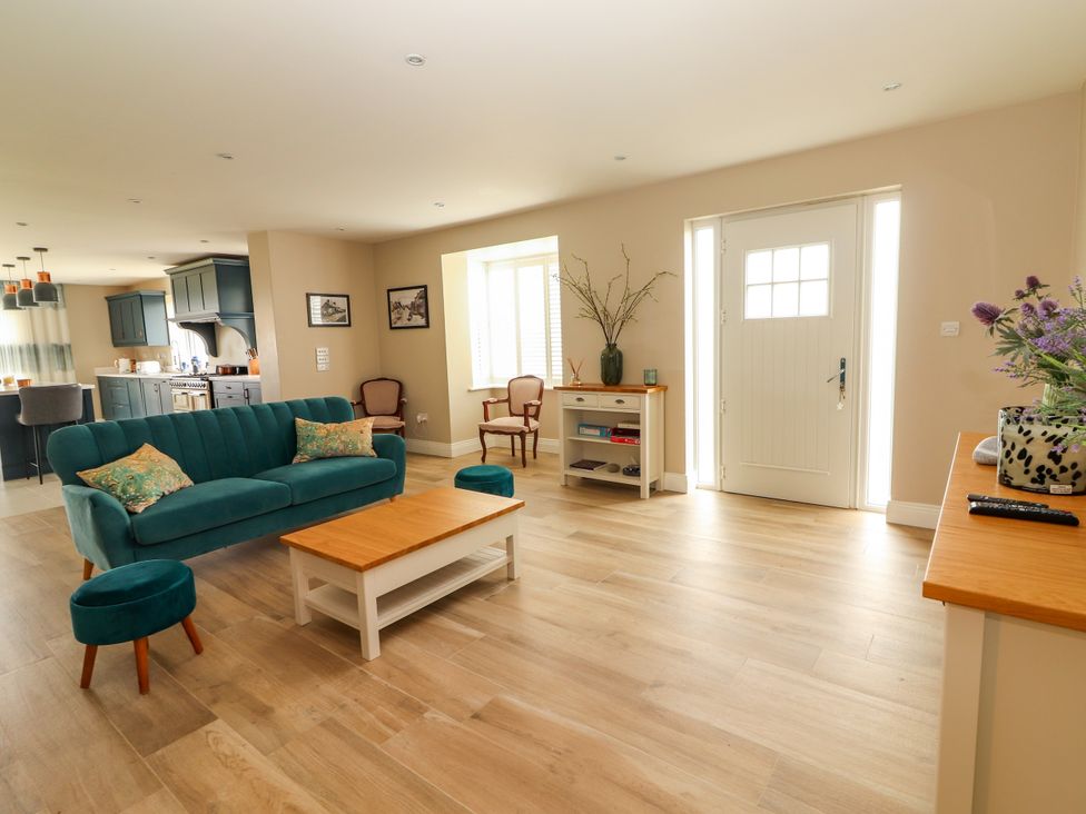 A living room with a sofa and coffee table at Carrowmore North, Doonbeg, County Clare