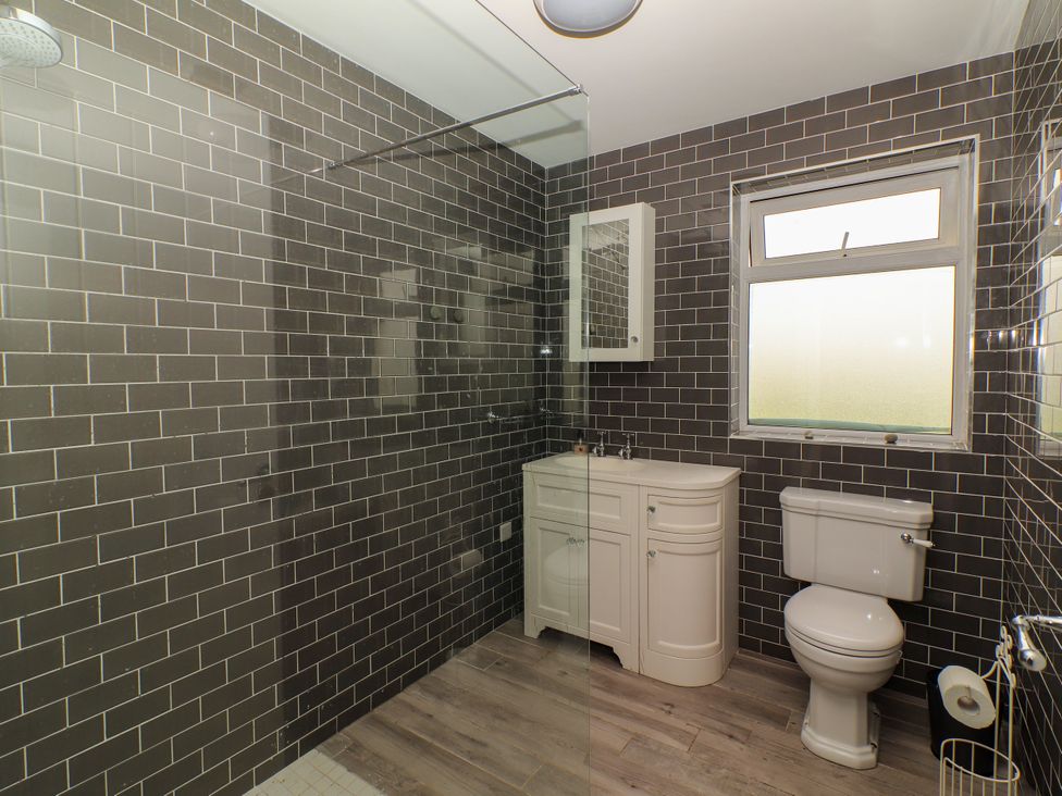 A bathroom with a shower and toilet at Carrowmore North, Doonbeg, County Clare
