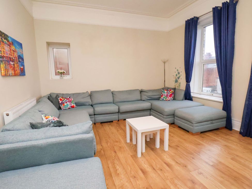 A living room with a sofa and coffee table at Wellington Lodge in Bridlington