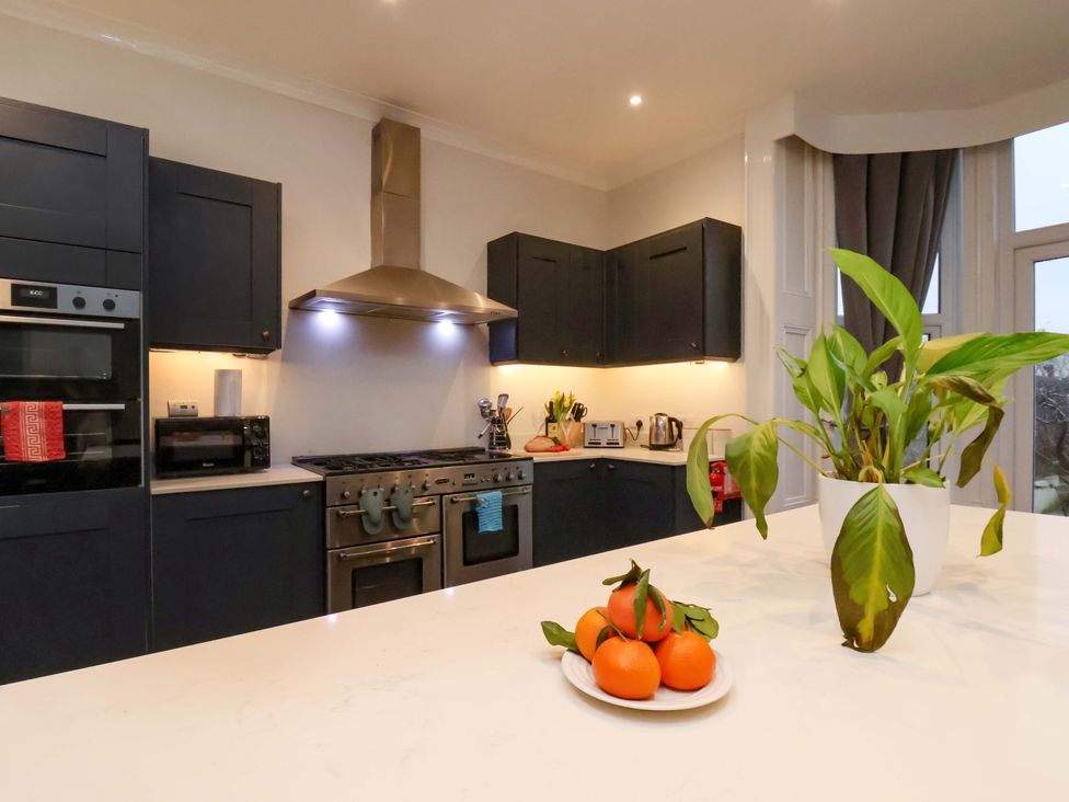 A kitchen with appliances and a fruit bowl at Wellington Lodge in Bridlington