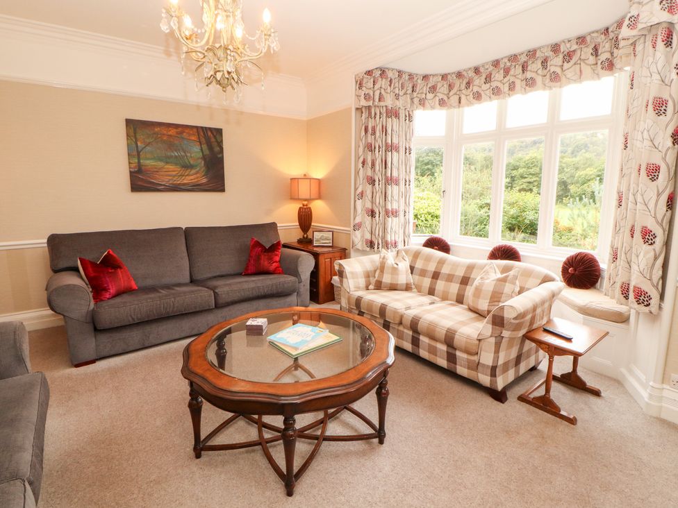 A living room with sofas and a coffee table at Bracken Howe in Ambleside