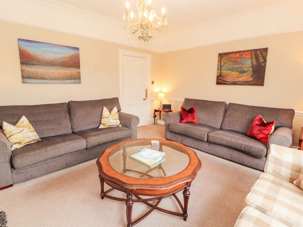 A living room with sofas and a coffee table at Bracken Howe in Ambleside