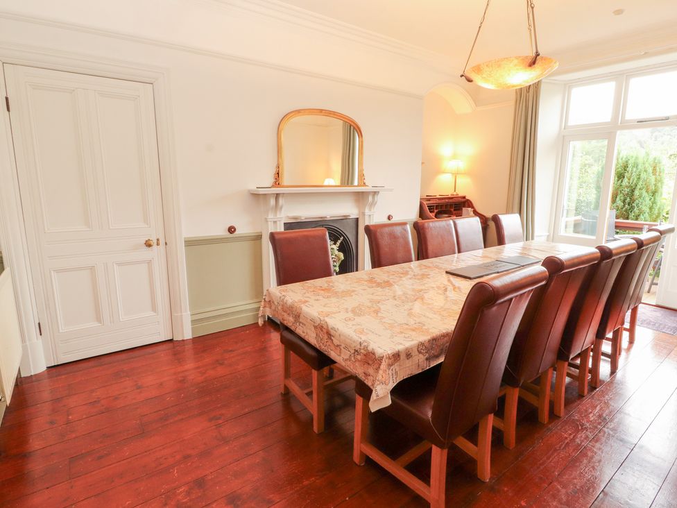 A dining room with a table and chairs at Bracken Howe in Ambleside