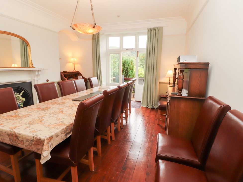 A dining room with a large table and chairs at Bracken Howe in Ambleside