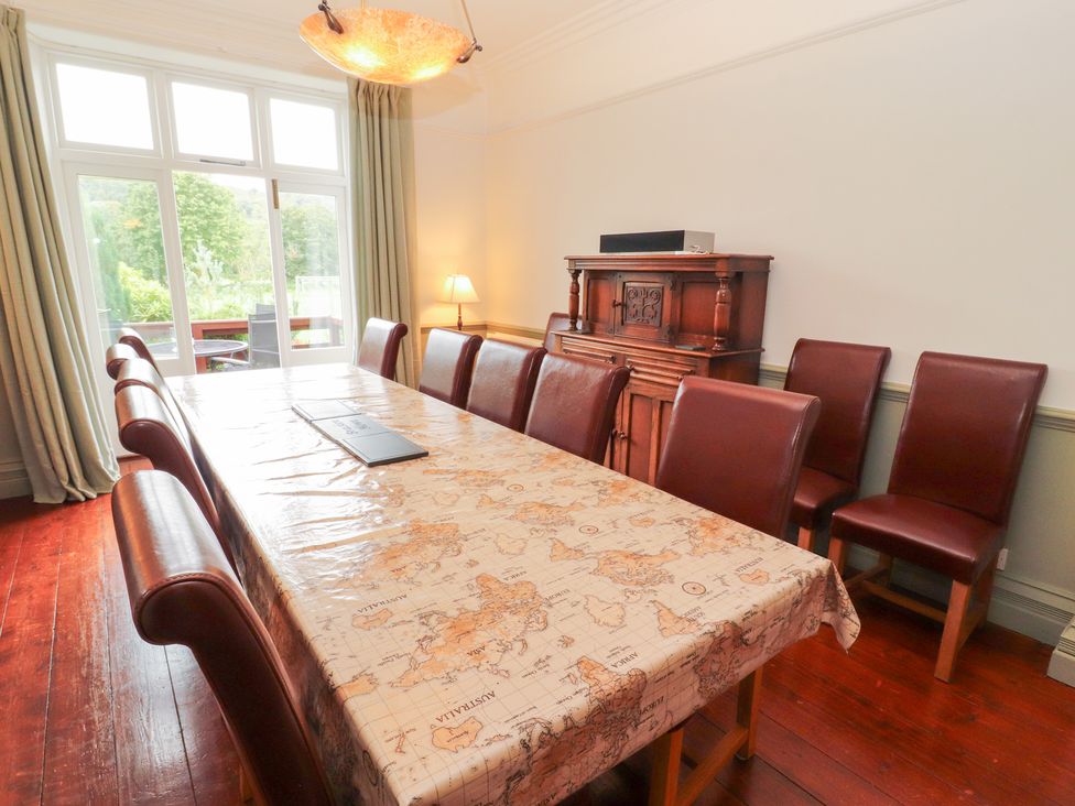 A dining room with a table and chairs at Bracken Howe in Ambleside