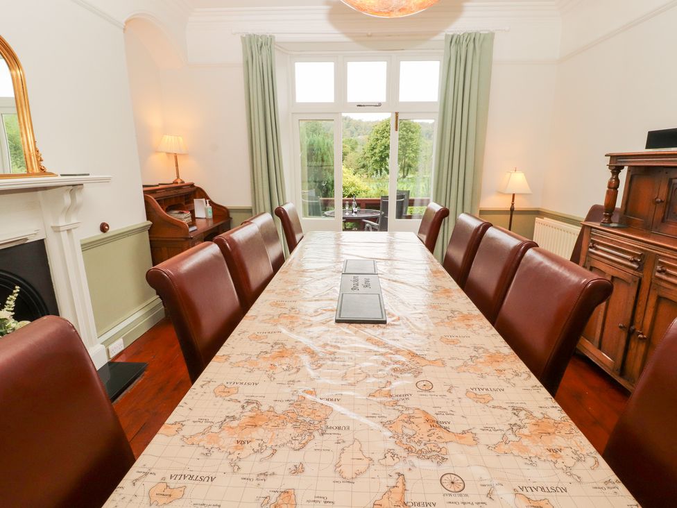 A dining room with a large table and chairs at Bracken Howe in Ambleside