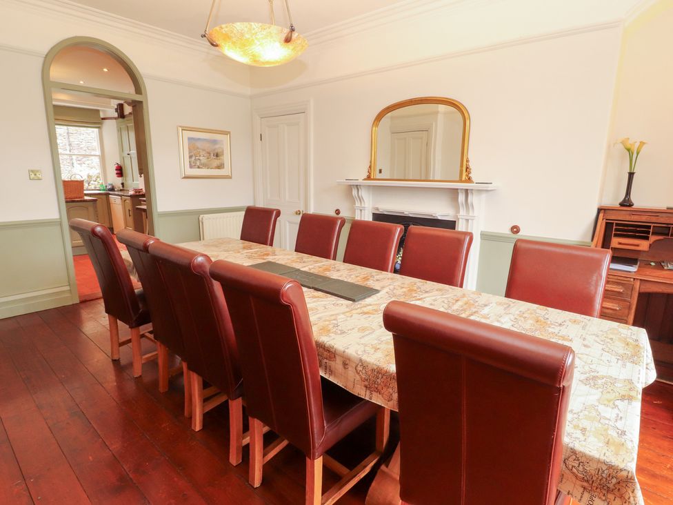 A dining room with a large table and chairs at Bracken Howe in Ambleside