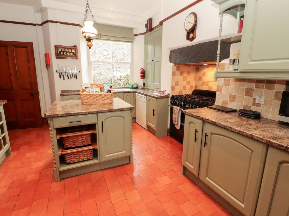 A kitchen with cabinets and appliances at Bracken Howe in Ambleside