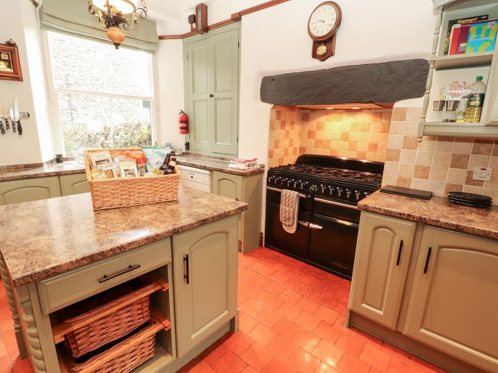A kitchen with cabinets and stove at Bracken Howe in Ambleside