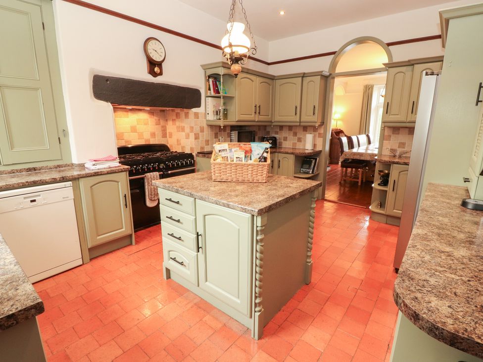 A kitchen with cabinets and a central island at Bracken Howe in Ambleside