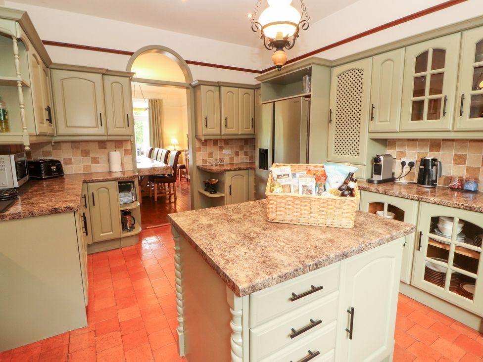 A kitchen with cabinets, countertop, and an island at Bracken Howe in Ambleside