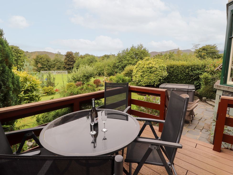 An outdoor area with a table and chairs at Bracken Howe in Ambleside