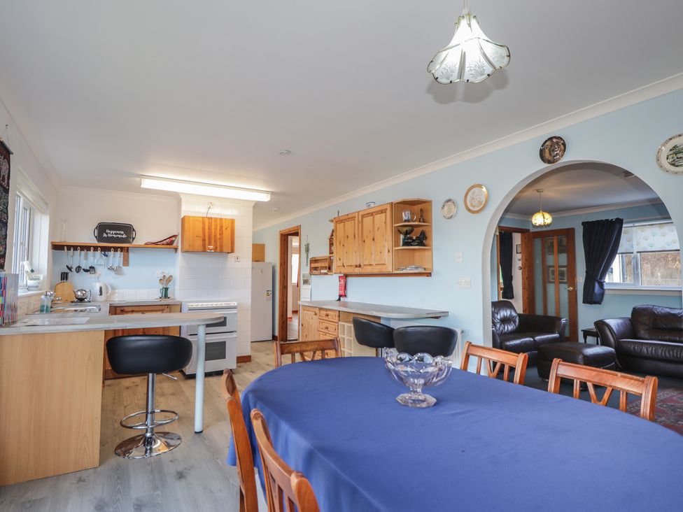 A kitchen with dining area at Arnaval in Carbost