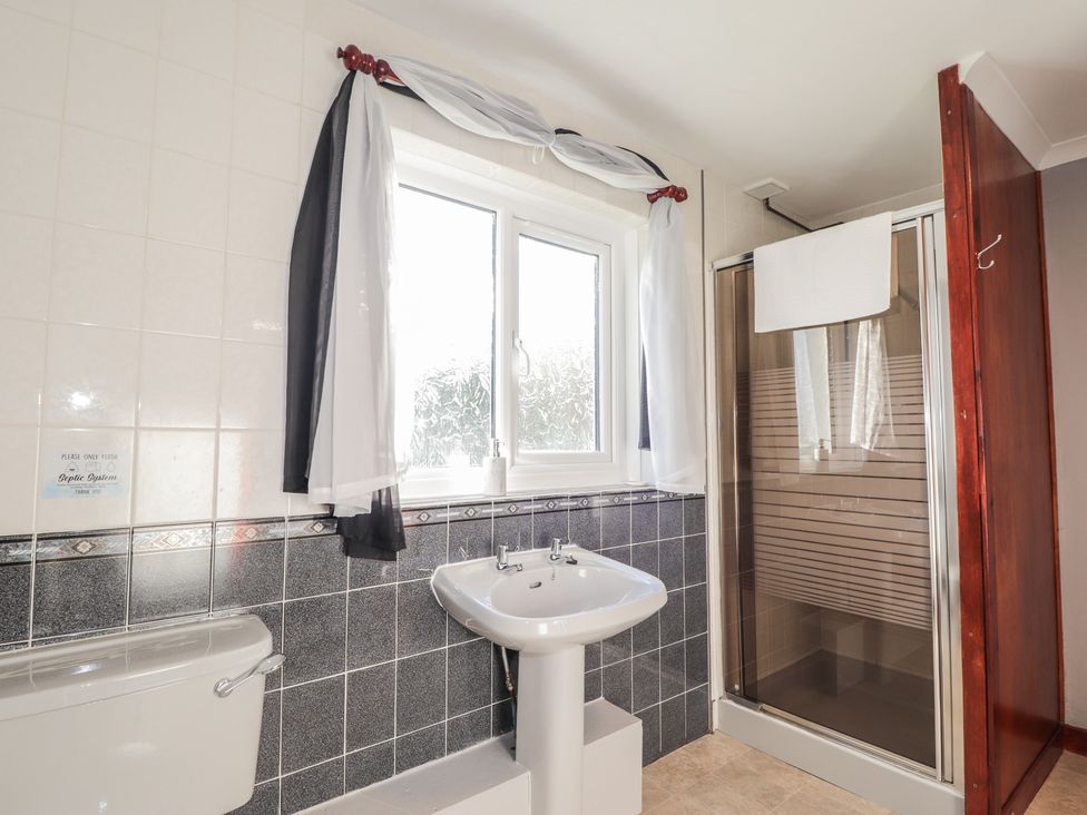 A bathroom with a sink and shower at Arnaval in Carbost