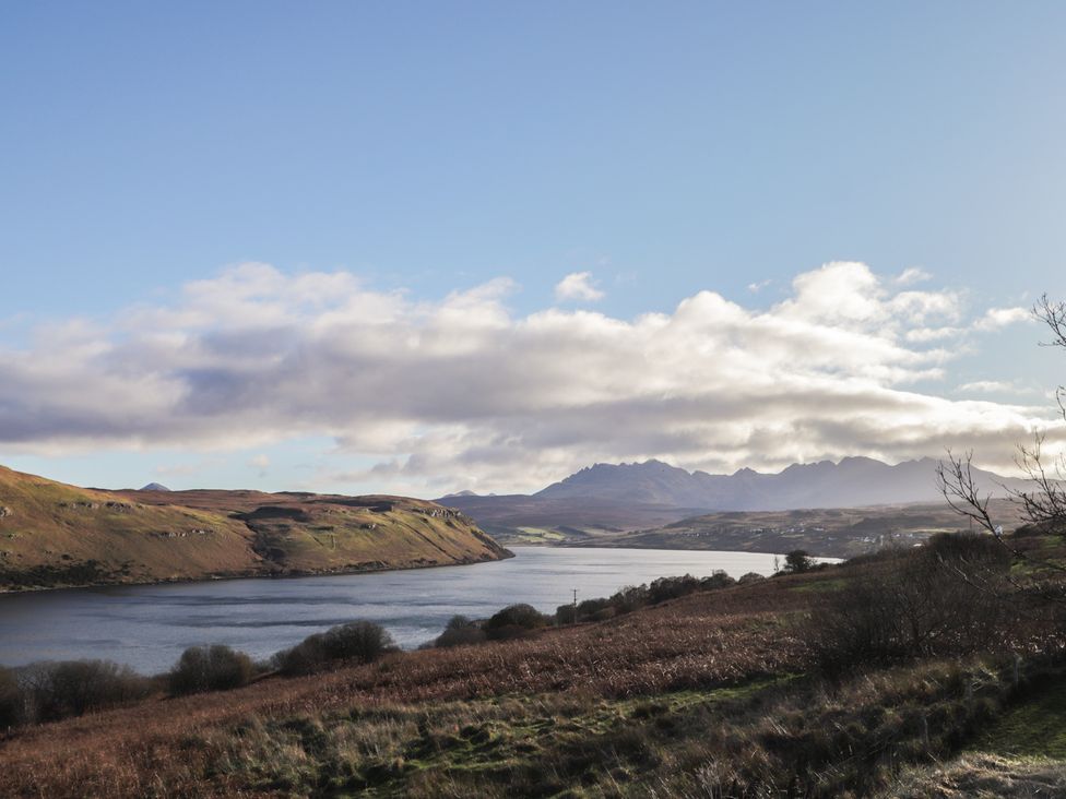 A landscape view of a lake and mountains at Arnaval in Carbost